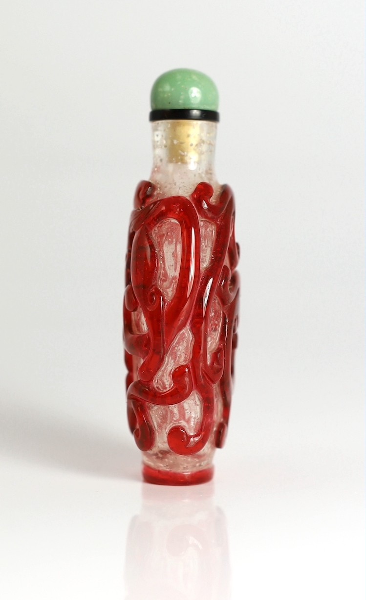 A Chinese ruby red overlay on snowflake ground snuff, 1750-1850, 7.4cm high